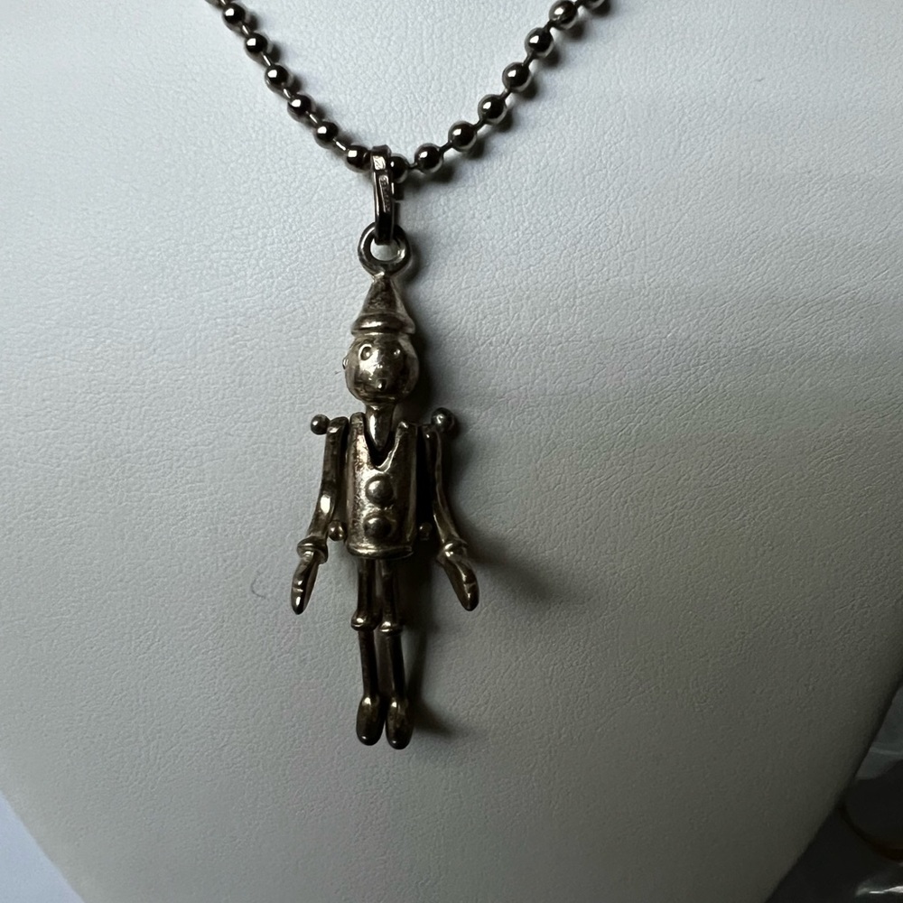 Serling articulated Pinocchio pendant.
